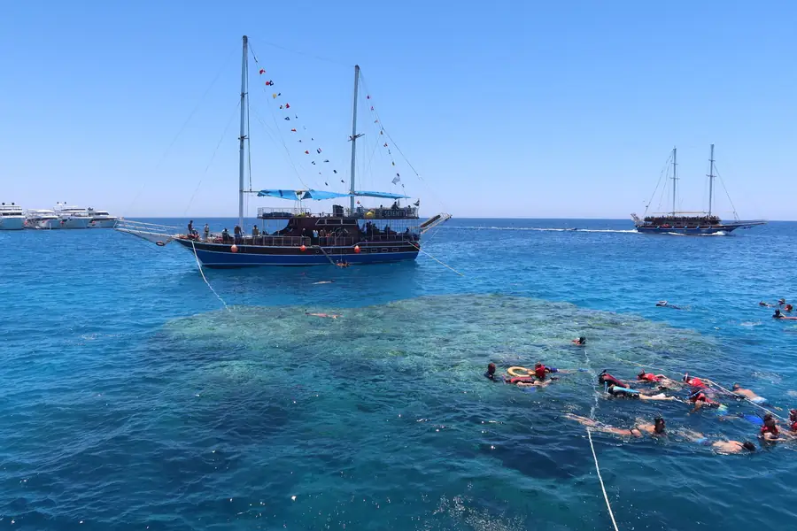 A day boat moored over the reef off Sharm El Sheikh.