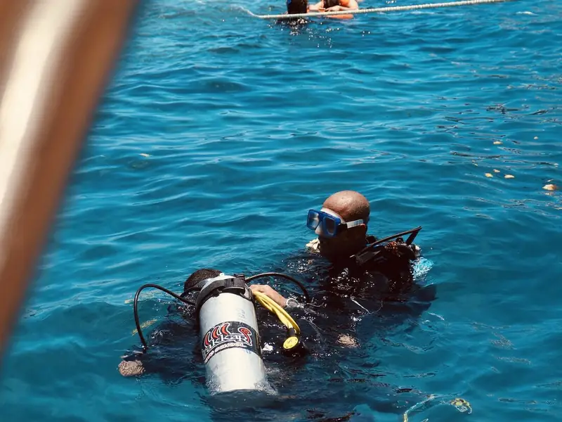 A diver in full kit at the surface before descending.