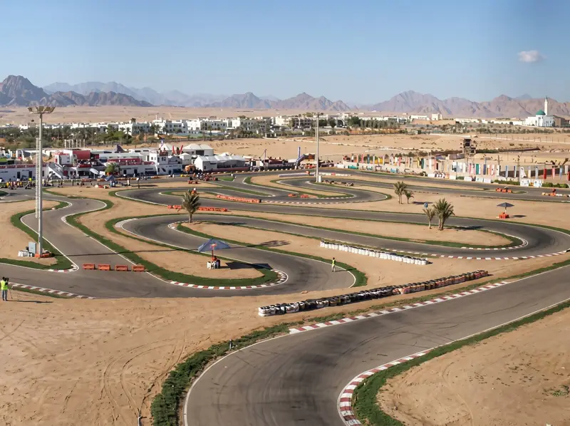 Aerial view of the go-kart track, with mountains behind