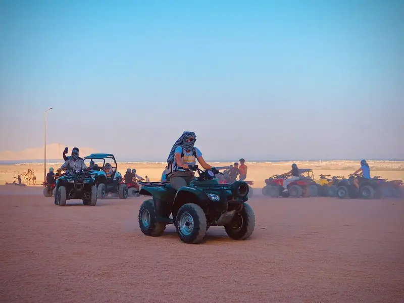 Quads out on the dunes as the light goes down over Sinai.